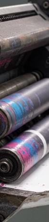 Printing press rollers coated in ink before cleaning